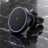 Magnetic wireless car charger mount on black marble, premium studio product shot