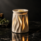 Scented wax warmer studio shot on black marble